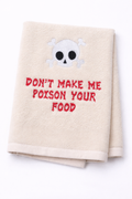 Beige towel with skull design and text 'Don't make me poison your food' on a white background