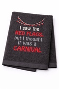 Gray towel with red and white text on a white background