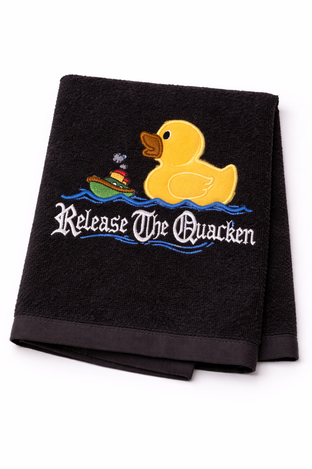 Black towel with yellow rubber duck and text 'Release The Quacken' on a white background